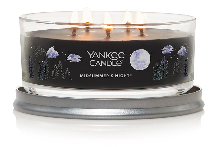 Yankee Candle Signature 5 Wick Tumbler in Midsummer Night scent, featuring a sleek tumbler with a brushed metal lid, emitting a deep and alluring fragrance.
