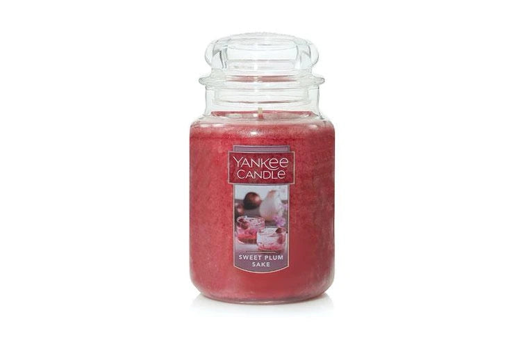 Yankee Candle Large Jar in Sweet Plum Sake scent, featuring an iconic glass jar with lid, emitting a refined and delightful fragrance.
