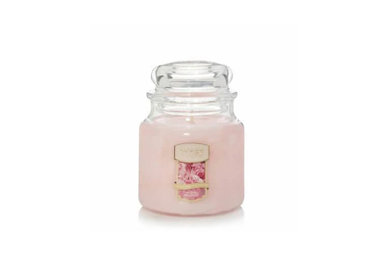 Yankee Candle Medium Jar in Blush Bouquet scent, featuring a classic glass jar with dome lid, emitting a sophisticated floral fragrance.
