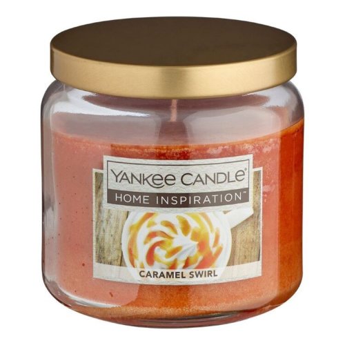 Yankee Candle Medium Jar in Caramel Swirl scent, featuring a classic glass jar with dome lid, emitting a sweet and indulgent caramel fragrance.
