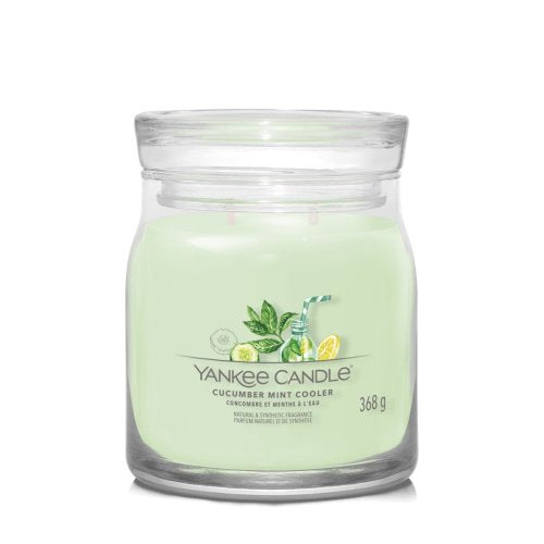 Yankee Candle Signature Medium Jar in Cucumber Mint Cooler scent, featuring a classic glass jar with lid, emitting a fresh cucumber and mint fragrance.
