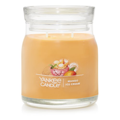 Yankee Candle Signature Medium Jar in Mango Ice Cream scent, featuring a classic glass jar with lid, emitting a sweet and creamy mango fragrance.
