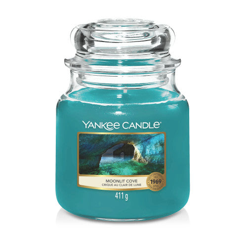 Yankee Candle Medium Jar in Moonlit Cove scent, featuring a classic glass jar with dome lid, emitting a serene and calming fragrance.
