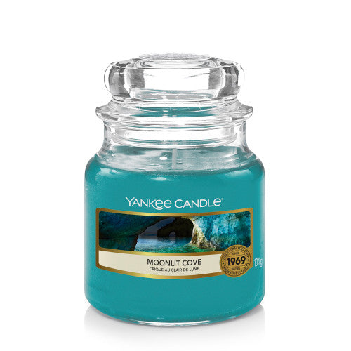Yankee Candle Small Jar in Moonlit Cove scent, featuring a classic glass jar with dome lid, emitting a serene and calming fragrance.
