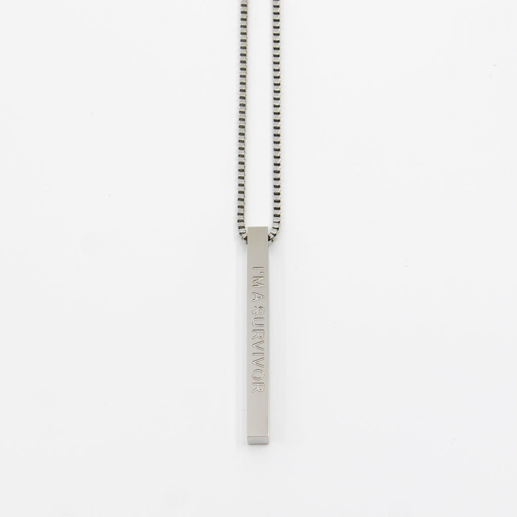 Fierce.One stainless steel bar pendant necklace with phrase "I'm a survivor."