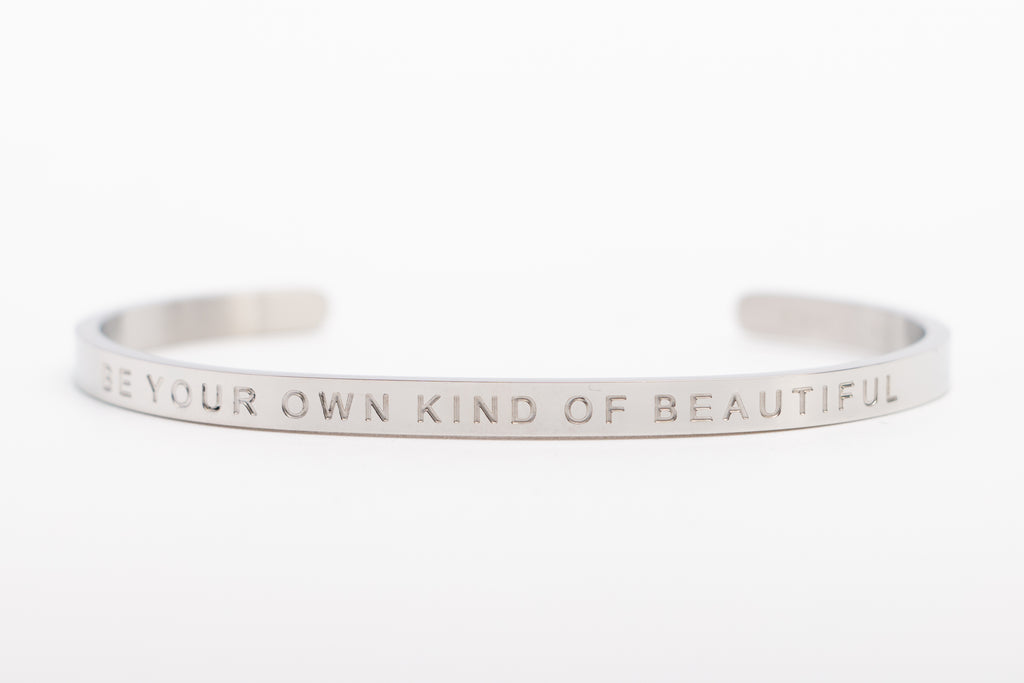 Fierce.One stainless steel bangle with phrase "Be your own kind of beautiful."
