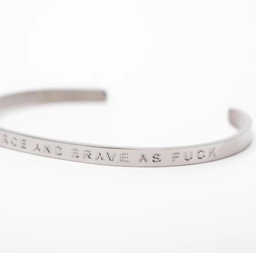 Fierce.One stainless steel bangle with phrase "Strong, Fierce and Brave as Fuck".